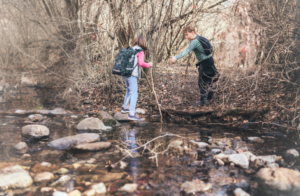 Twp children in woods symbolizing the joy of exploration before eating disorders developed